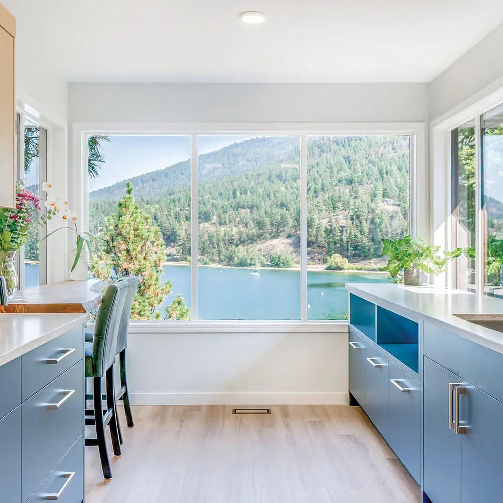 Finished LDR kitchen renovation on Delcliffe Road with two-tone cabinetry and a wall of windows over Okanagan Lake
