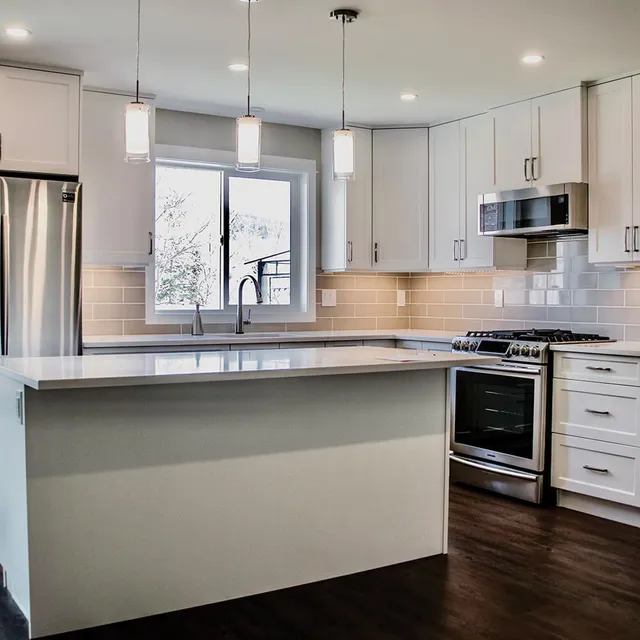 White shaker kitchen with quartz island built by LDR Construction