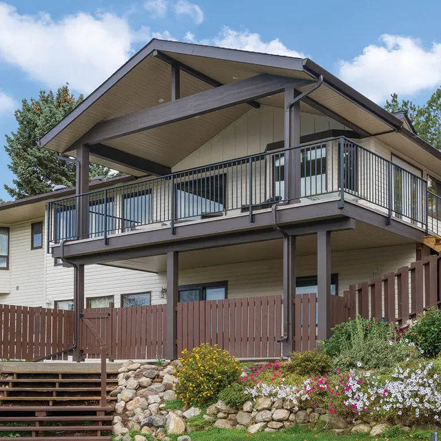 Large covered cedar deck with gable roof built by LDR Construction